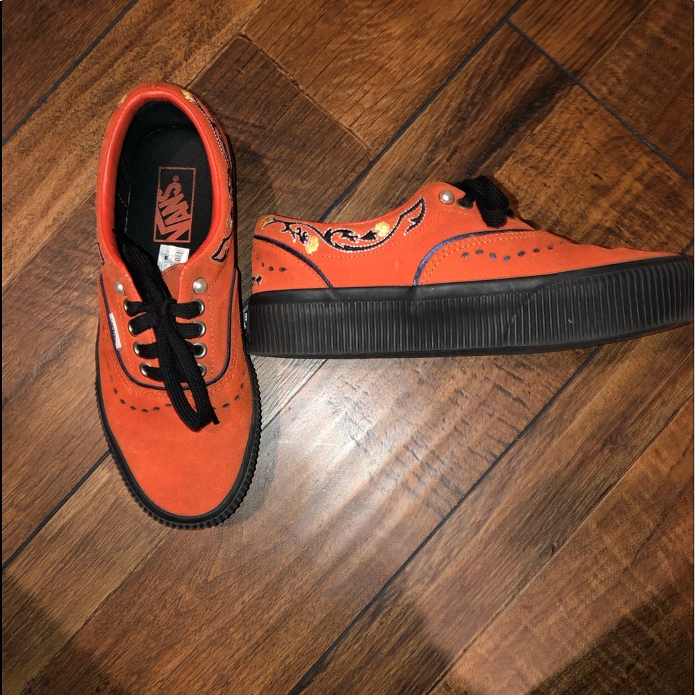 orange/yellow flowers low vans.